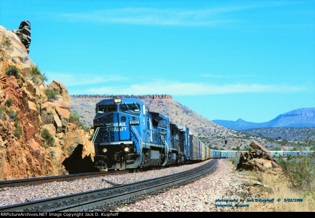 CR, Conrail 6162- 6154- 3284, in unfamiliar territory with a westbound on the AT&SF, Santa Fe at, Valentine, Arizona. May 2, 1996. 